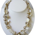 Go anywhere with this double strand of mother of pearl freshwater pearl and beige coral necklace.Beautiful triangular mother of 
