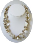 Go anywhere with this double strand of mother of pearl freshwater pearl and beige coral necklace.Beautiful triangular mother of 