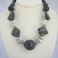 Contemporary black and white.  Sard onyx, howlite and zebra jasper necklace. Horizontal lines in center stone are light reflecti