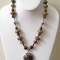 Reddish brown jasper and sterling pendant on jasper necklace.  Great shapes for a distinct look. SG2054  19.75-20.75" long 