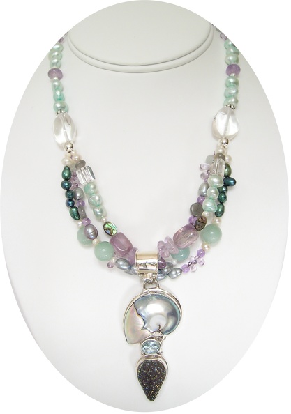 Shell and druzy quartz pendant on triple strand of freshwater pearls, amethyst and rose quartz necklace.  SOLD