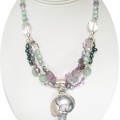 Shell and druzy quartz pendant on triple strand of freshwater pearls, amethyst and rose quartz necklace.  SOLD