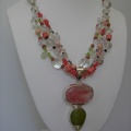 Strawberry_quartz_with_green_chalcedony_pendant_on_triple_t.jpg