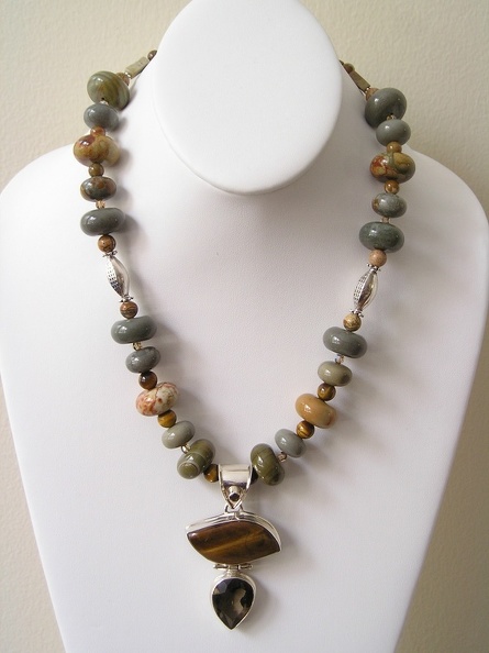 Tiger_s_eye_and_smokey_quartz_sterling_pendant_on_ocean_jasper_necklace.jpg