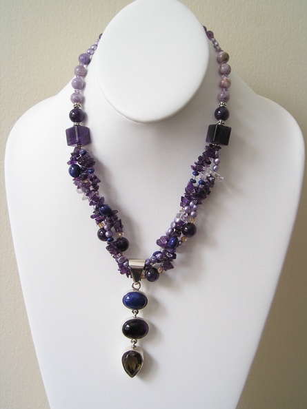 Triple sterling pendant of smokey quartz, amethyst and lapis on triple strand of pearls and amethyst necklace. Triple_sterling_pendant_of_smokey_quartz_amethyst_and_lapis_on_triple_strand_of_pearls_and_amethyst_necklace.jpg