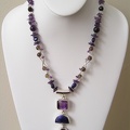 Triple strand of amethyst, lapis and smokey quartz on double strand of smokey quartz and sterling tubes.  TT2023  20&quot; long 