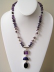 Triple strand of amethyst, lapis and smokey quartz on double strand of smokey quartz and sterling tubes.  TT2023  20&quot; long 